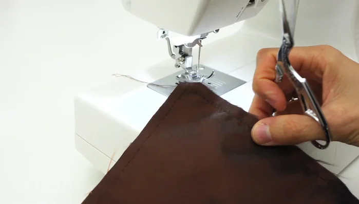 Finish seams: Trim corners, and use a zig-zag stitch or serger to finish raw edges.