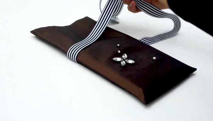 Add ribbon: Attach ribbon if desired.