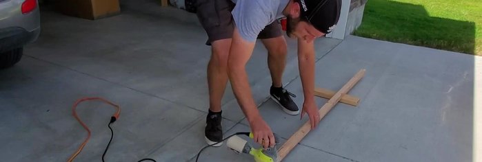 Sand the 2x2x8 piece of wood to remove rough edges.