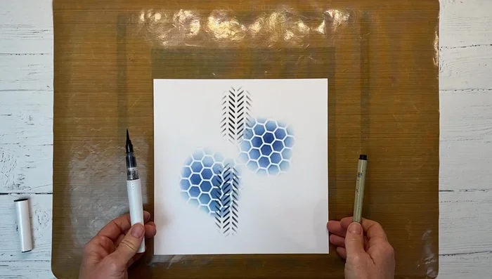 Adding texture: Use a black shimmer brush to create splatters on the background for added interest.