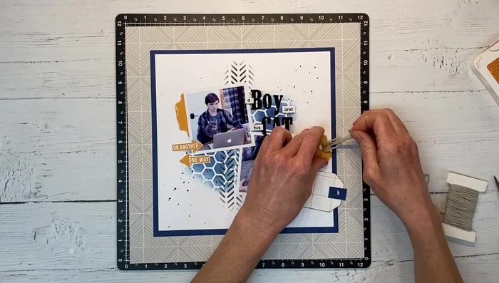 Finishing touches: Add journaling, twine, and other elements to complete the project.