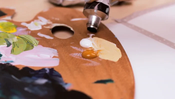 Apply a thin layer of the grayish-brown base color all over the paper or canvas.