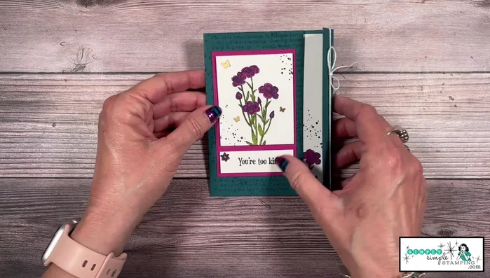 Assemble the second card: Adhere the stamped and colored pieces to the card base. Decorate with Wink Stella, brass butterflies, and Baker's Twine.