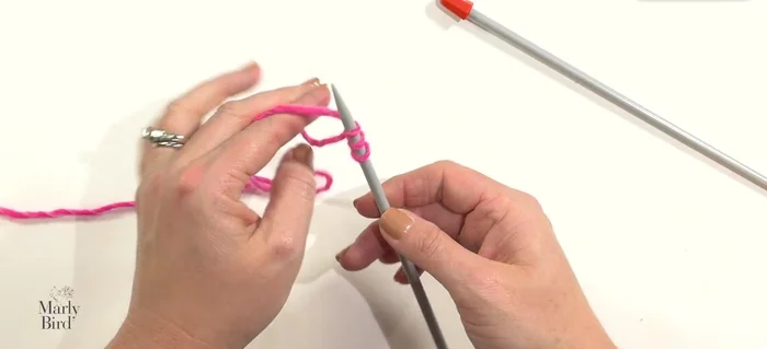 Cast on three stitches using the longtail cast-on method.