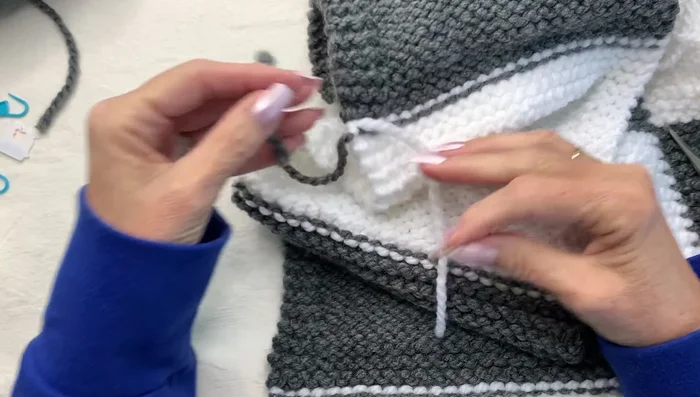 Weave in ends using the mattress stitch method to seamlessly join panels.