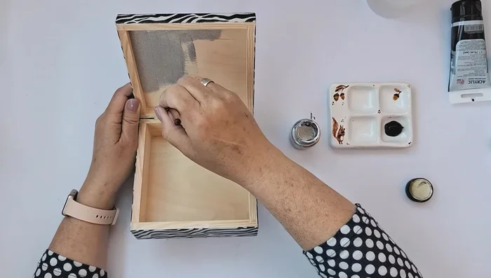 Apply glue for silver leaf to the silver painted areas and apply silver leaf/flakes, removing excess with a brush. Polish with a soft cloth and seal with shellac or protective varnish.