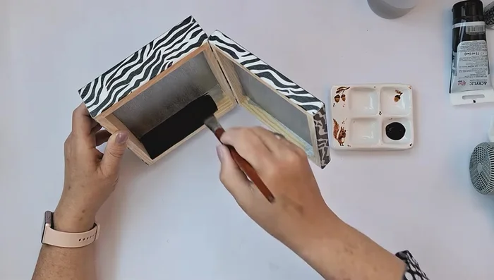 Apply glue for silver leaf to the silver painted areas and apply silver leaf/flakes, removing excess with a brush. Polish with a soft cloth and seal with shellac or protective varnish.