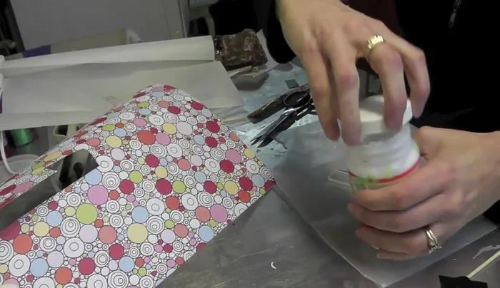 Place the glass, Mod Podge side down, onto the cut paper, pressing gently to adhere.