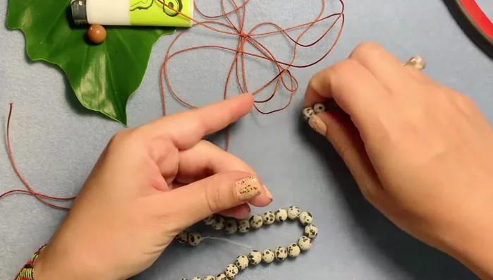 Count out 23 beads and two extras for tassels.
