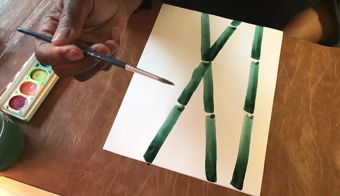 Clean your brush. Using the tip of the brush, create small branches at each node, pulling thin lines in different directions from each node.