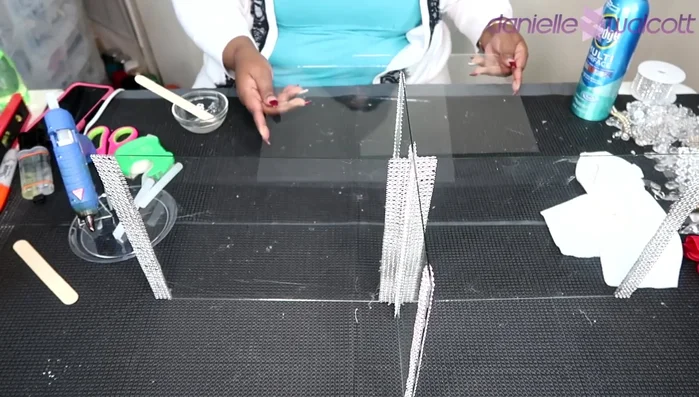 Carefully join the two glass panes for the shelf, ensuring alignment. Hold for 5-10 minutes to set.