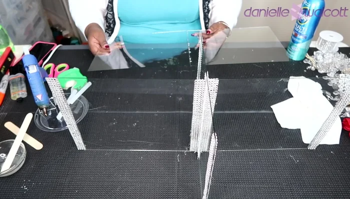 Carefully join the two glass panes for the shelf, ensuring alignment. Hold for 5-10 minutes to set.