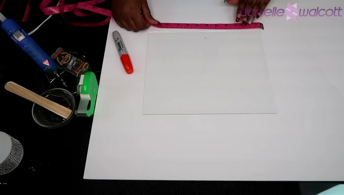 Carefully place a second glass pane onto the epoxy, ensuring alignment with the marked center. Hold in place for 5-10 minutes to allow the epoxy to set. (Consider using assistance to hold the glass panes in place.)