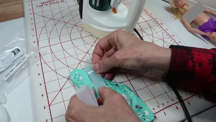 Attach Velcro or snaps for closure.