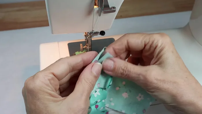 Apply Fray Check to the neckline and shoulders to prevent fraying.