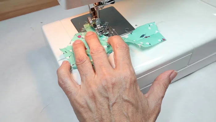 Attach Velcro or snaps for closure.