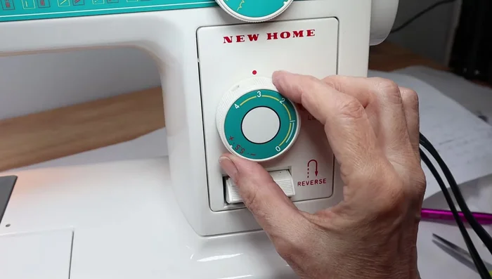 Sew the skirt to the bodice, hiding the gathering stitches.