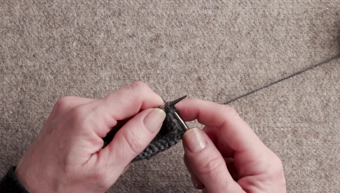 Pass the third stitch over the first two stitches and off the needle.