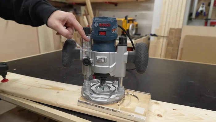 Using the router, carefully carve the lantern face design, moving clockwise.