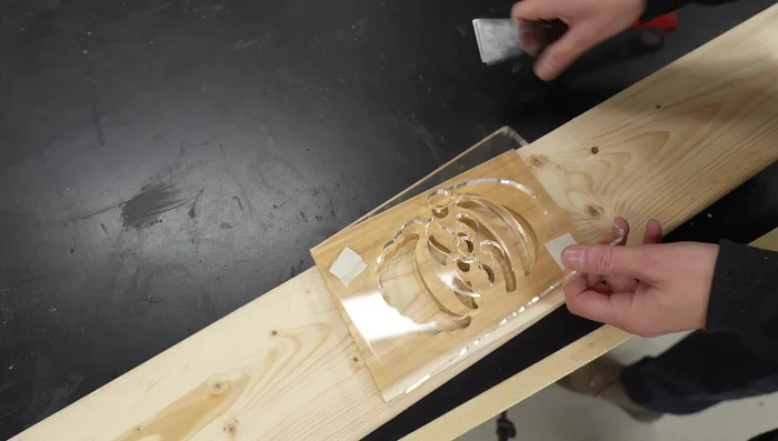 Gently remove the template and the carved lantern face from the backer board.