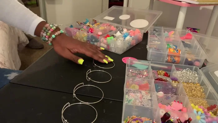 Gather materials: bangles, charms (at least 8-11), split rings.