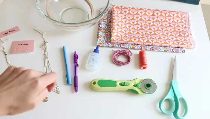 Trace and cut fabric circles: Using a glass bowl (10 inches) or embroidery hoop (6.5 inches), trace two large and two small circles on each fabric piece. This allows you to create two pouches from two fat quarters, or one pouch from one fat quarter.