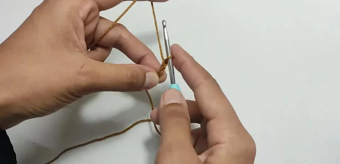 Join the first and last chains of the base to form a ring.