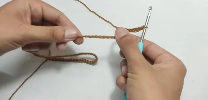 Join the first and last chains of the base to form a ring.