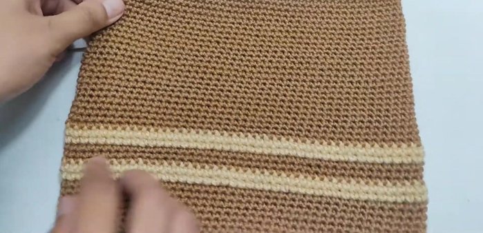 Fold the sides and stitch them together to form the chair's sides. 