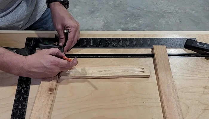 Attach backer pieces to the two larger sides using wood glue, brad nails, and screws, leaving space for the smaller sides.