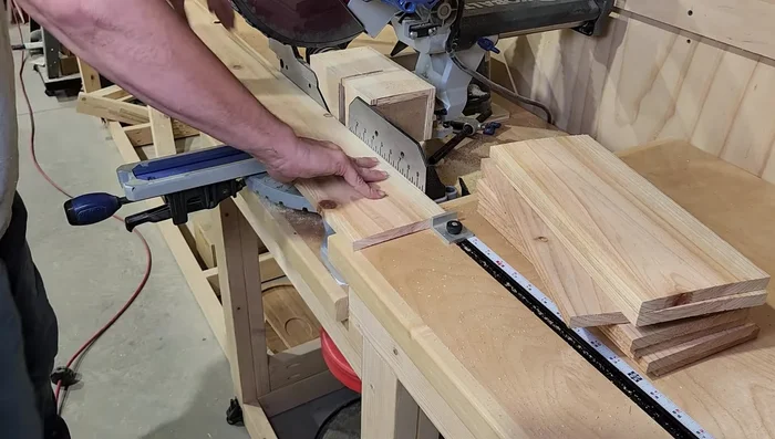 Attach backer pieces to the two larger sides using wood glue, brad nails, and screws, leaving space for the smaller sides.