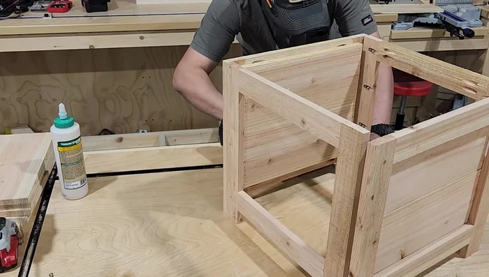 Add bottom slats for support and plant placement, evenly spaced and fastened with wood glue and screws.