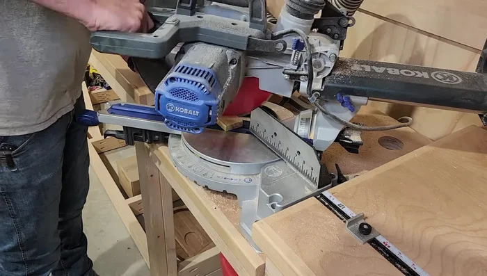 Attach the top cap to the planter using wood glue and brad nails, ensuring even overhang.
