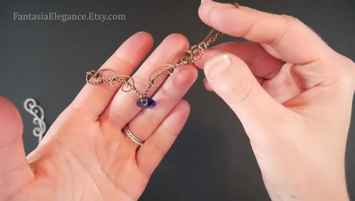 Add the stone (optional): Attach a top-drilled briolette or your preferred stone to the center.