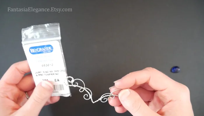 Attach the chain and clasp: Attach a fine cable chain (2-3mm) to each end of the design using jump rings (2.5-3mm inner diameter). Add a clasp of your choice.