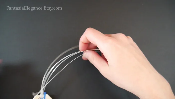 Prepare the wire: Cut a 13-inch piece of 20-gauge wire for the twisted center part and two 3.5-inch pieces for the decorative overlays.