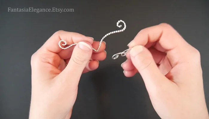 Assemble the necklace: Position the overlay pieces on top of the center piece, ensuring proper alignment. Use short lengths of 24-gauge wire to bind the pieces together at the points where they overlap, using 3-5 wraps for each connection point.