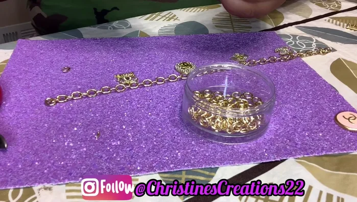 Attach charms evenly spaced along the anklet using jump rings. (636.2)