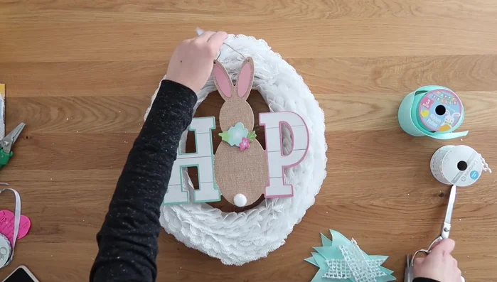 Attach a hanging sign (optional) to the wreath using hot glue.