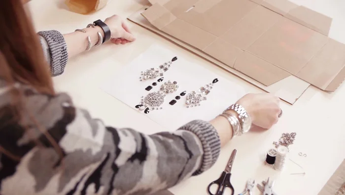 Place wood, cardboard, then PVC plastic on top. Gently slide the paper with beads onto the PVC.