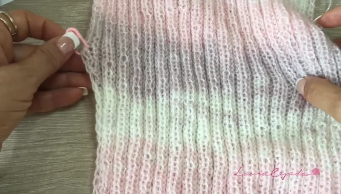 Work in pattern until desired length is reached. Increase one stitch on each side every three rows by picking up the stitch below and knitting through it.