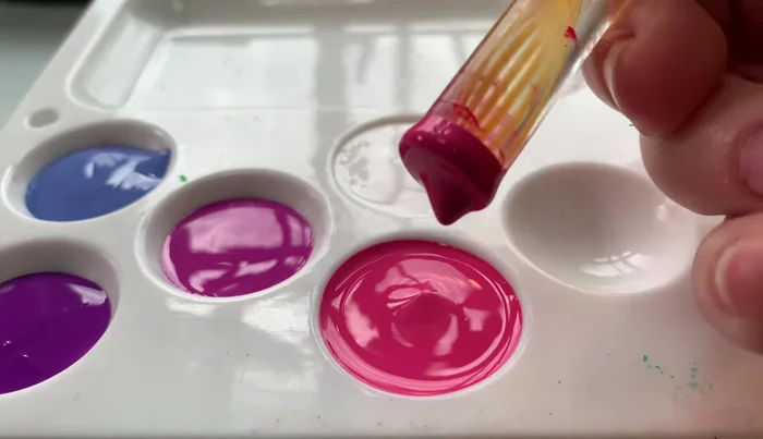 Second row of dots: Create a second row of larger dots using a different color, between the dots of the first row.