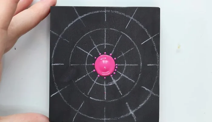 Second row of dots: Create a second row of larger dots using a different color, between the dots of the first row.