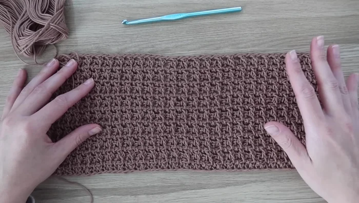 Seam shoulders: Using the long tails, slip stitch the last row of both shoulders of the front panel to the back panel.