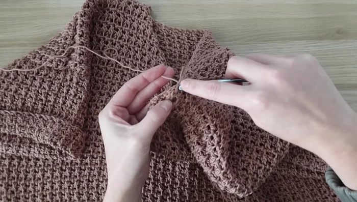 Neckline trim: Join a new piece of yarn at the shoulder seam and single crochet evenly around the neckline, not pulling too tight. Fasten off.