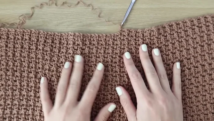 Decreasing Rows (Rows 49-59): Work decreases by skipping the first stitch in each row; alternate Rows 49 and 50 until 32 stitches remain for size small. Fasten off.