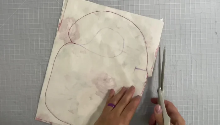 Cut into the neck area along the traced pattern line.