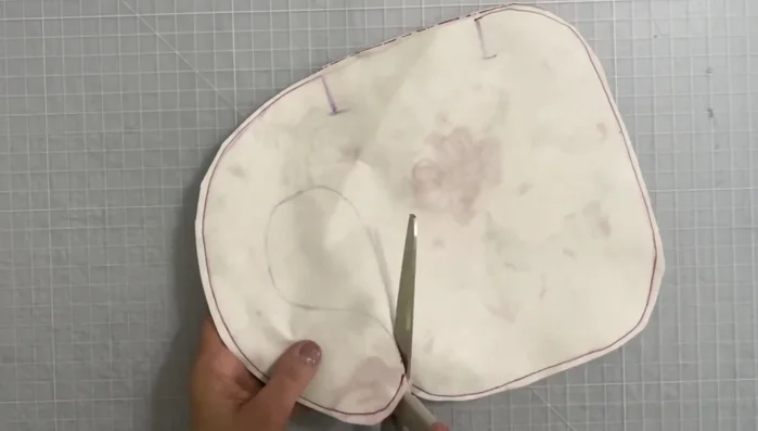 Cut into the neck area along the traced pattern line.