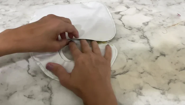 Top stitch around the entire bib and neck area.