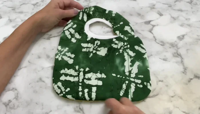 Top stitch around the entire bib and neck area.